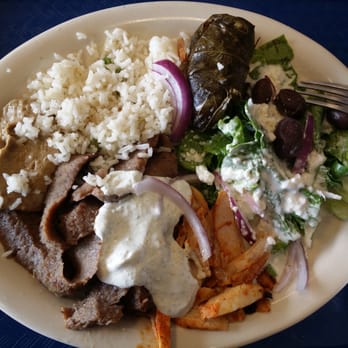 Zorba - Combo w/ tzatziki sauce, feta salad, rice, baba ghanoush, and stuffed grape leaves. - Greek Near Me - Round Rock, Texas Zorba - Combo w/ tzatziki sauce, feta salad, rice, baba ghanoush, and stuffed grape leaves. - Greek Near Me - Round Rock, Texas