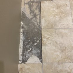 East Valley Floors - Old peninsula was at an angle. EVF carefully removed cut tiles and old grout without damaging surrounding tiles.