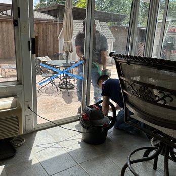 Richardson Glass - Mike and TJ working together to remove the old broken sliding glass door. - Windows Installation Near Me - Mckinney, Texas Richardson Glass - Mike and TJ working together to remove the old broken sliding glass door. - Windows Installation Near Me - Mckinney, Texas
