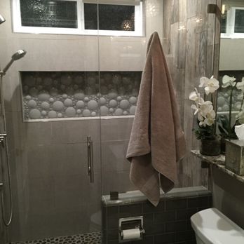 Blizzard Frameless Shower Doors - Towel hanging on hook - Glass & Mirrors Near Me - Huntington Beach, California Blizzard Frameless Shower Doors - Towel hanging on hook - Glass & Mirrors Near Me - Huntington Beach, California