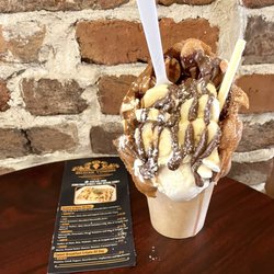 Belgian Yummies - The Bubble Waffle Chunk Monkey sundae- vanilla gelato, banana, Nutella bananas, chocolate drizzle and homemade whipped cream.