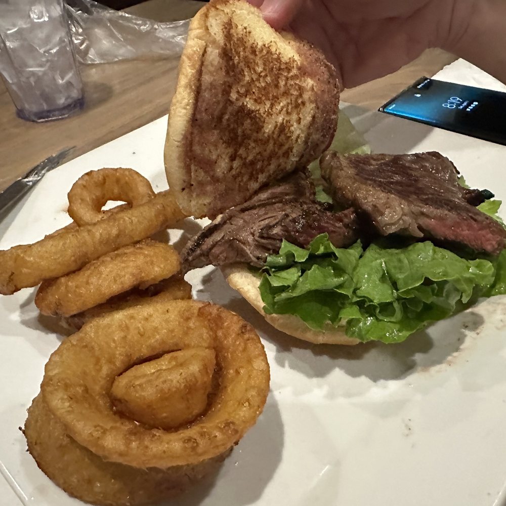 Olympic Steak & Pizza - Arlington - Steak sandwich with onion rings - Steakhouses Near Me - Arlington, Tennessee