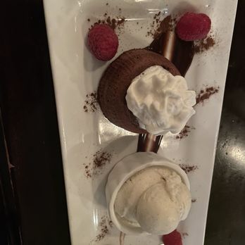 Corridor 44 - Chocolate Molten Lava Cake | Chocolate cake with hot fudge center & berrries and a scoop of vanilla ice cream. - Champagne Bars Near Me - Denver, Colorado