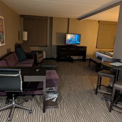 Hotel Marshfield - King Suite has a sleeper sofa, small desk, and a dinner table. Spacious enough to share or be alone!