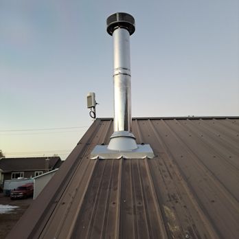 Capital Chimney Service - Metal roof flashing on wood stove Chimney install - Chimney Sweeps Near Me Capital Chimney Service - Metal roof flashing on wood stove Chimney install - Chimney Sweeps Near Me
