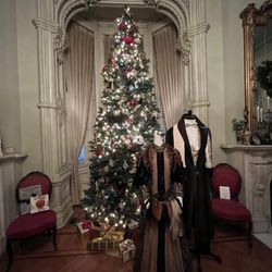 Woodruff-Fontaine House Museum - Period appropriate clothing and decor in the living room.