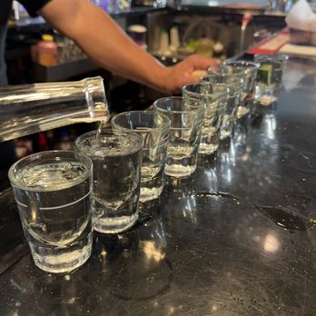 Via Mar Grill & Bar - a line of shot glasses lined up on a bar - Mexican Near Me - Ontario, California Via Mar Grill & Bar - a line of shot glasses lined up on a bar - Mexican Near Me - Ontario, California