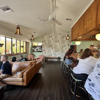 HandleBar - a group of people sitting at a bar - Cocktail Bars Near Me - Mount Dora, Florida