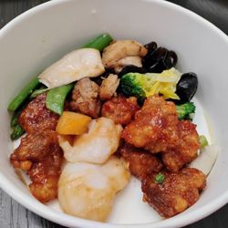 My first time trying their hot bar. $2.69/100g. This was around $8. (General Tao's Chicken, fish, mushrooms and vegetables).