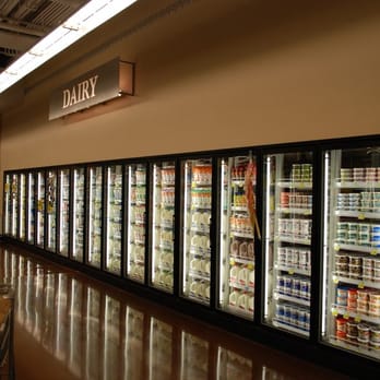 QFC - a row of refrigerators in a grocery store - Grocery Near Me - Seattle, Washington