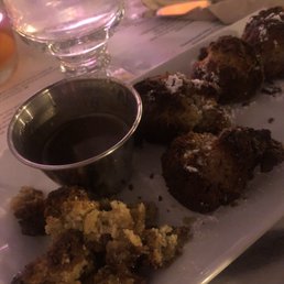 Burnt banana fritter. There is no banana it in, Look like burnt meatballs, taste like burnt doughs. Charge $8+tax for this garbage. Burnt banana fritter. There is no banana it in, Look like burnt meatballs, taste like burnt doughs. Charge $8+tax for this garbage.
