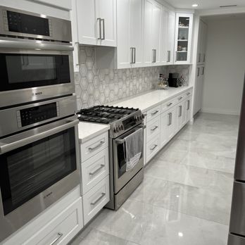 A1 Home Remodeling - a kitchen with white cabinets and stainless steel appliances - General Contractors Near Me - Culver City, California A1 Home Remodeling - a kitchen with white cabinets and stainless steel appliances - General Contractors Near Me - Culver City, California