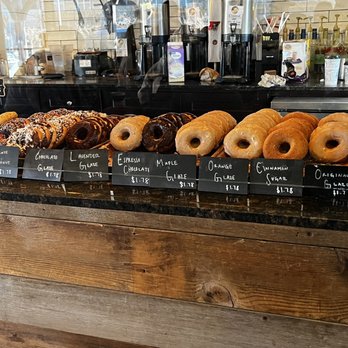 The Local Lion - a variety of doughnuts on display - Donuts Near Me - Boone, North Carolina