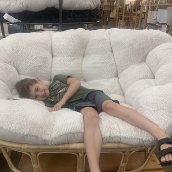 World Market - My grandson luxuriating on this papasan chair he wants for his birthday!  Says it's very comfy. - Furniture Stores Near Me - Temecula, California