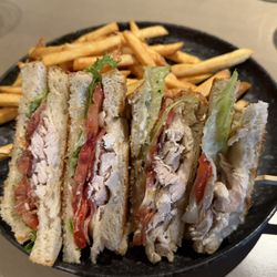 The Maligne Range - Smoked Chicken Club - pulled smoked chicken, bacon, swiss cheese, romaine lettuce, beef tomato, peppercorn aioli, toasted sourdough