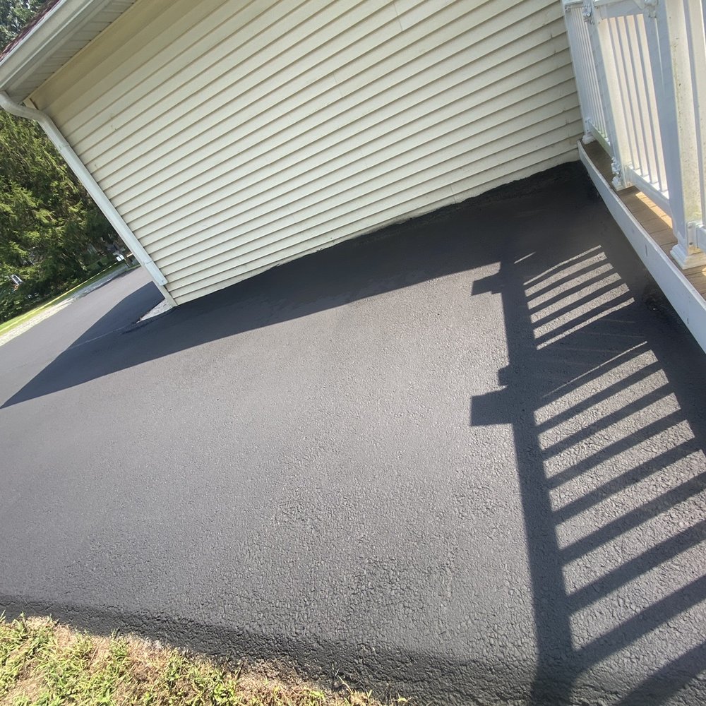 Apex Asphalt Services - Pothole next to garage filled in and sealed - Masonry/Concrete Near Me - Rising Sun, Maryland