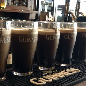 Ollie's Pub - a row of guinness glasses - Irish Pub Near Me - Lodi, California