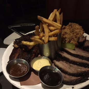 The Carbon Bar - Pit Master Platter (2 person portion): Brisket, ribs, buttermilk fried chicken, fries , dipping sauce - Barbeque Near Me - Toronto, Ontario The Carbon Bar - Pit Master Platter (2 person portion): Brisket, ribs, buttermilk fried chicken, fries , dipping sauce - Barbeque Near Me - Toronto, Ontario