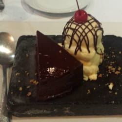 House of Wagyu Stone Grill - Flourless chocolate cake a la mode on a cold stone.
