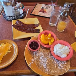 Swedish pancakes with peaches and cream, candles bacon & scrambled egg Swedish pancakes with peaches and cream, candles bacon & scrambled egg