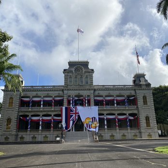 Iolani Palace - The exterior of the palace, decorated in celebration of King Kalakaua's upcoming birthday. - Museums Near Me - Honolulu, Hawaii