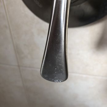 Merry Maids of Nassau County, NY - Shower handle right after cleaning. - Home Cleaning Near Me - Levittown, New York