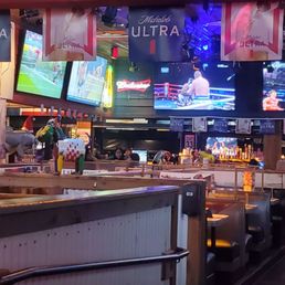 a woman standing at the bar