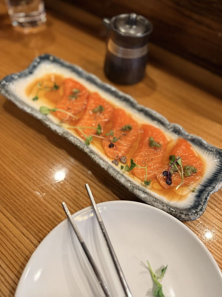 Taki Sushi and Grill Logo