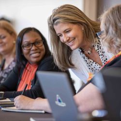 Money Management International - MMI staff at a team meeting