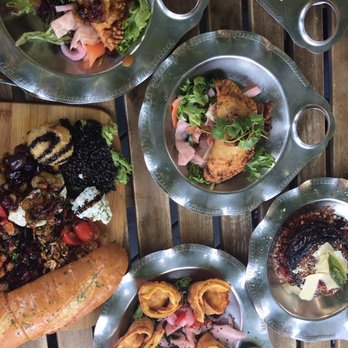 Blacksmith Bar & Restaurant - Cheese Board, samosas, empanadas, shrimp and goat cheese wantons, stacked crispy eggplant, peach tea - Bars Near Me - Berlin, Maryland