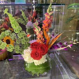 My mother's birthday flowers. $75 + tax of course. Bigger than it looks here. She was happy (can't put a price on that!) My mother's birthday flowers. $75 + tax of course. Bigger than it looks here. She was happy (can't put a price on that!)