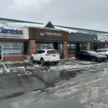 Curiouser Coffee & Elixers - Located inside a strip mall. You will walk in the doors for burgers and bottles to get to this spot - Coffee & Tea Near Me - Eagan, Minnesota