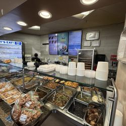 Valerio's City Bakery - Assorted hot dishes options/ menu board.
