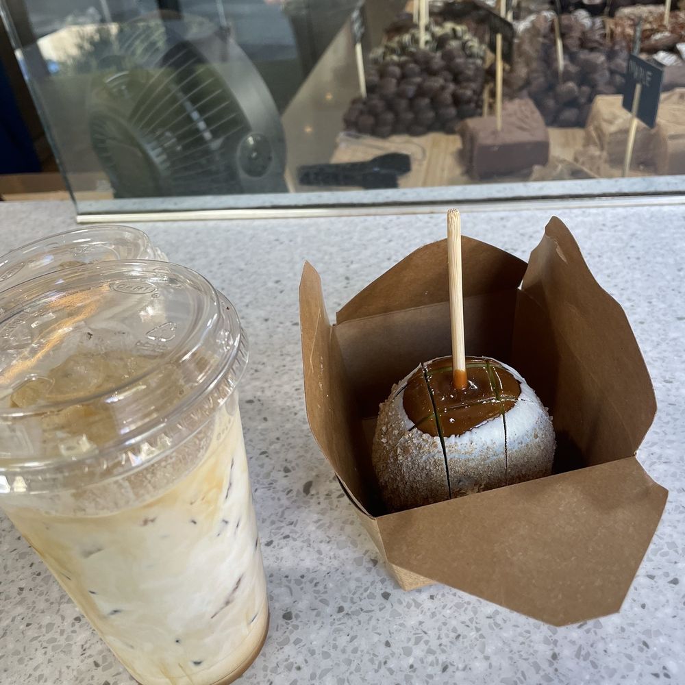 Temptations Chocolate Cafe - a cup of iced coffee and a chocolate covered donut - Coffee & Tea Near Me - Valencia, California Temptations Chocolate Cafe - a cup of iced coffee and a chocolate covered donut - Coffee & Tea Near Me - Valencia, California
