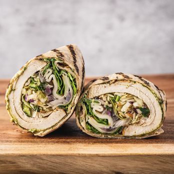 Porta Via - a cut in half sandwich on a cutting board - Sandwiches Near Me - Toronto, Ontario Porta Via - a cut in half sandwich on a cutting board - Sandwiches Near Me - Toronto, Ontario