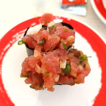 Genki Sushi - a plate of food on a table - Sushi Bars Near Me - Kaneohe, Hawaii