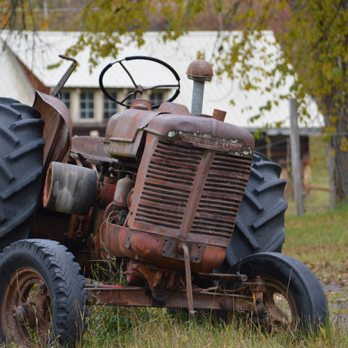 Aaron's Lawn Service - an old tractor in a field - Lawn Services Near Me - Wichita, Kansas Aaron's Lawn Service - an old tractor in a field - Lawn Services Near Me - Wichita, Kansas