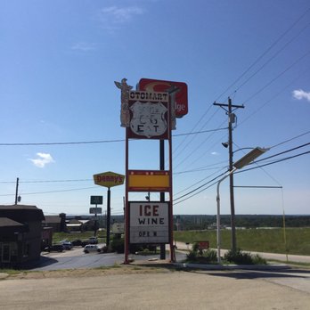 Totem Pole Trading Post - a clock and ice cream sign - Gift Shops Near Me - Rolla, Missouri