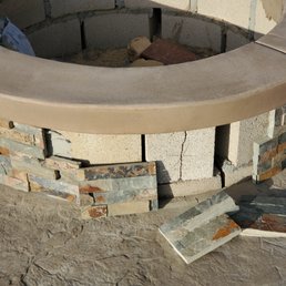 Stone was hardly adhered to the firepit. It fell off. Dave's guys used silicone caulking to put it back. It fell off again.