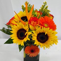 Estrella's Flower Shop - New bright sunshine. Beautiful flowers in a vase.