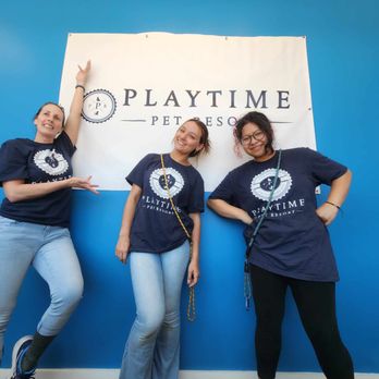 Playtime Pet Resort - Playtime Pet Resort Windham team members pose proudly in front of the facility's branded banner, reflecting the friendly and ... - Dog Walkers Near Me - Windham, New Hampshire