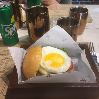 Pound By Todd English - The backyard burger with caramelized onions, fried egg and gruyère cheese! - Burgers Near Me - Taguig, NCR