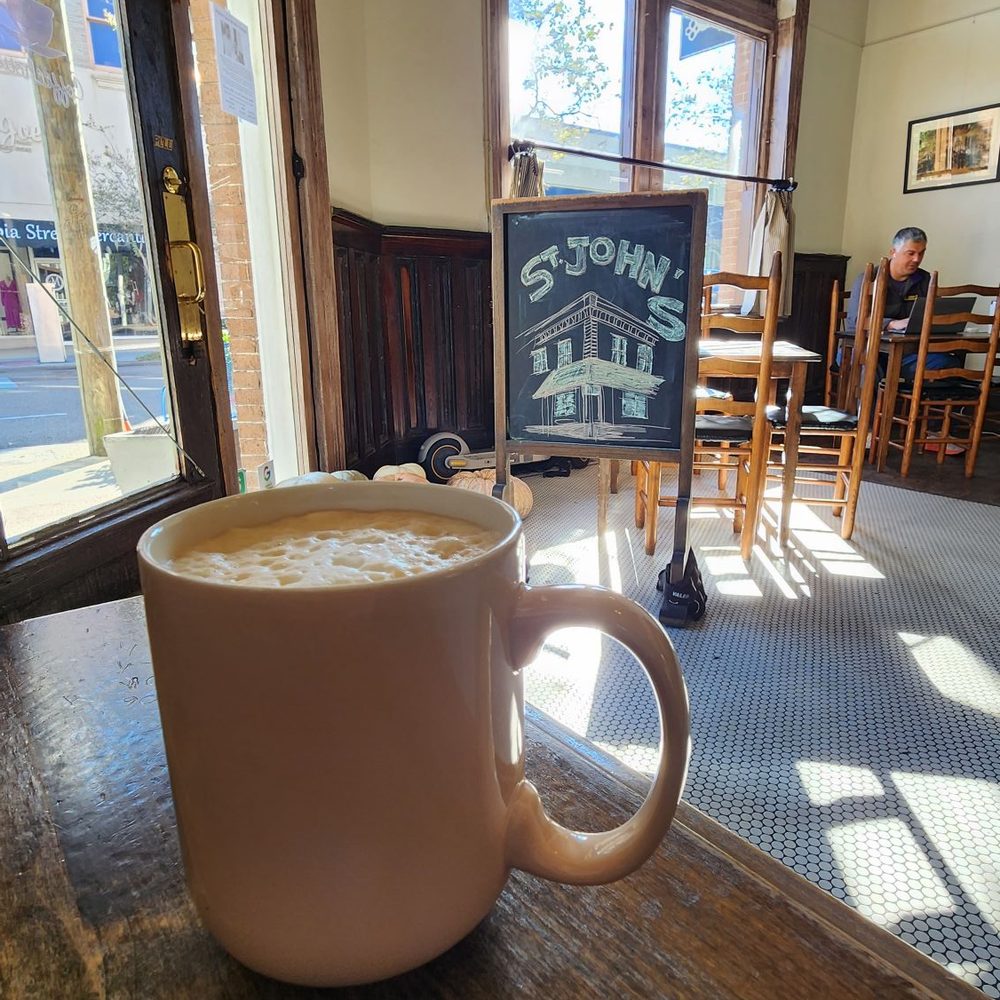 St. John's Coffeehouse - Coffee at table next to entrance - Coffee & Tea Near Me - Covington, Louisiana