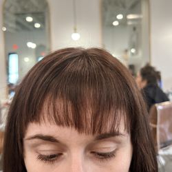 ML Beauty Bar - Uneven bangs and you can see the shorter bangs where the texture shears were used making it worse.