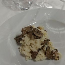 A small helping from a split dish of risotto tortufo. The whole serving of any pasti is plenty of food to satisfy. A small helping from a split dish of risotto tortufo. The whole serving of any pasti is plenty of food to satisfy.