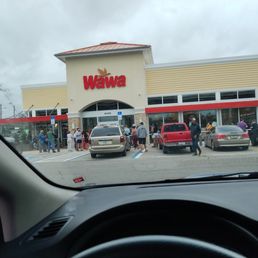 People arriving And waiting on the store to open