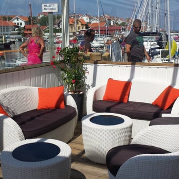 Saltkusten Kök & Bar - Lounge area. It is larger than what I am showing here, with more wicker chairs and tables. - Professional Services Near Me - Gullholmen, O Saltkusten Kök & Bar - Lounge area. It is larger than what I am showing here, with more wicker chairs and tables. - Professional Services Near Me - Gullholmen, O