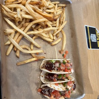 Buffalo Wild Wings - a tray of fries and a taco - Sports Bars Near Me - Prattville, Alabama