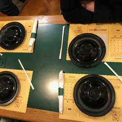 Monical's Pizza - Tables are clean, flatware wrapped and bowls inverted covering plates with adorable place mats for the kids or the kid in you