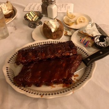 Sky Club Supper Club - Full rack of ribs with baked potato. - American Near Me - Plover, Wisconsin Sky Club Supper Club - Full rack of ribs with baked potato. - American Near Me - Plover, Wisconsin